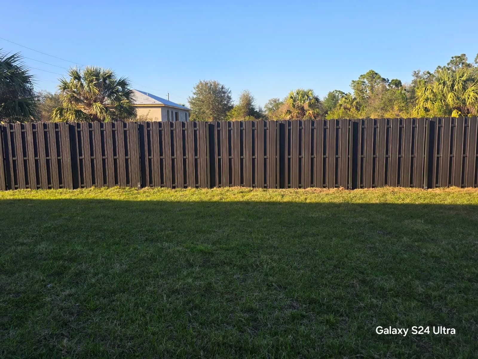 Completed metal privacy fence installed by True Fence Florida